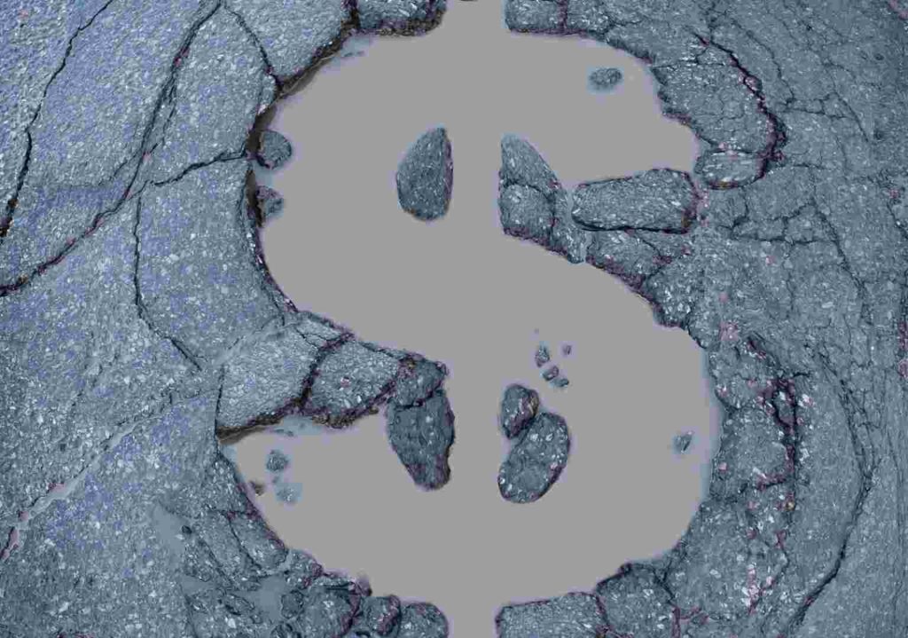 dollar sign in the middle of a pothole
