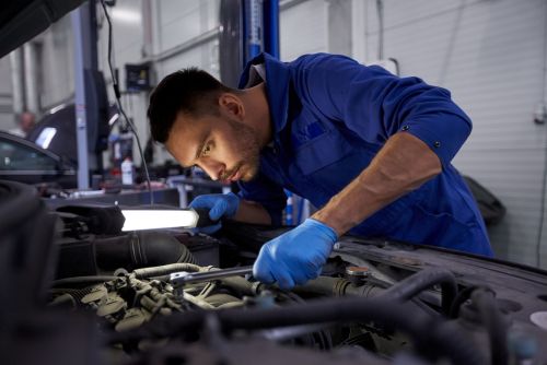 ASE certified mechanic working on customer car